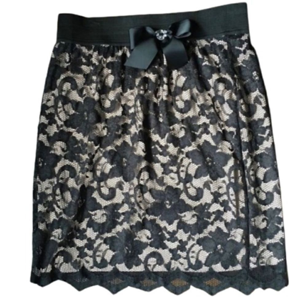 Smart Set Lace Skirt with Nude Lining. Elastic waistband and optional brooch.